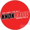KDNK AM 1080 / 98.7 FM - KNDK Logo