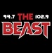 94.7/102.9 The Beast - WOZZ Logo